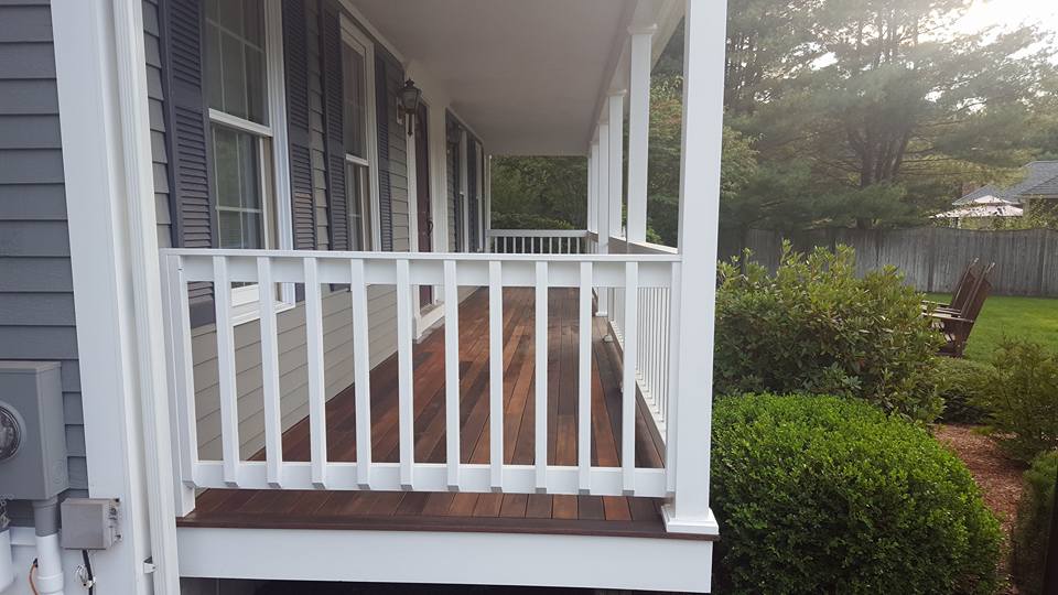 Finished espresso stained porch with white rails