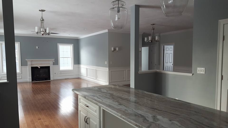 Kitchen and dining before remodel with blue paint and separating wall